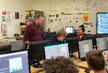 Students work on computers in a high school coding class.