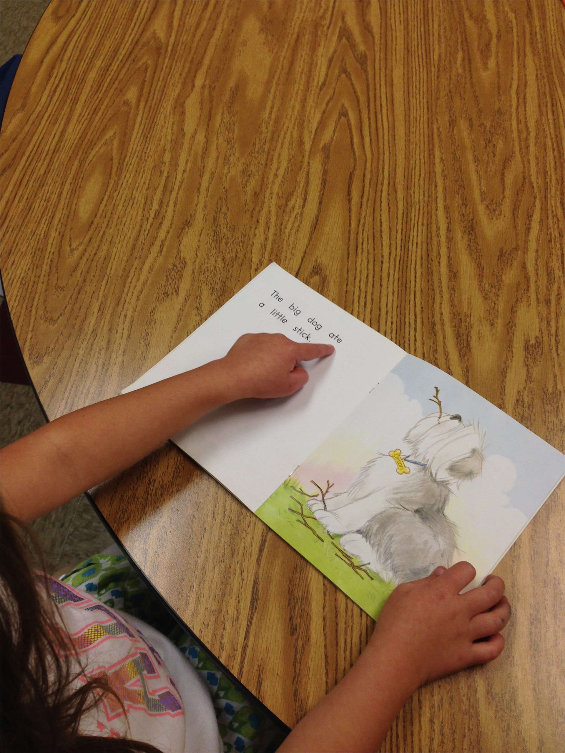 Students read a new book at a lower level to build confidence and practice sight words. 