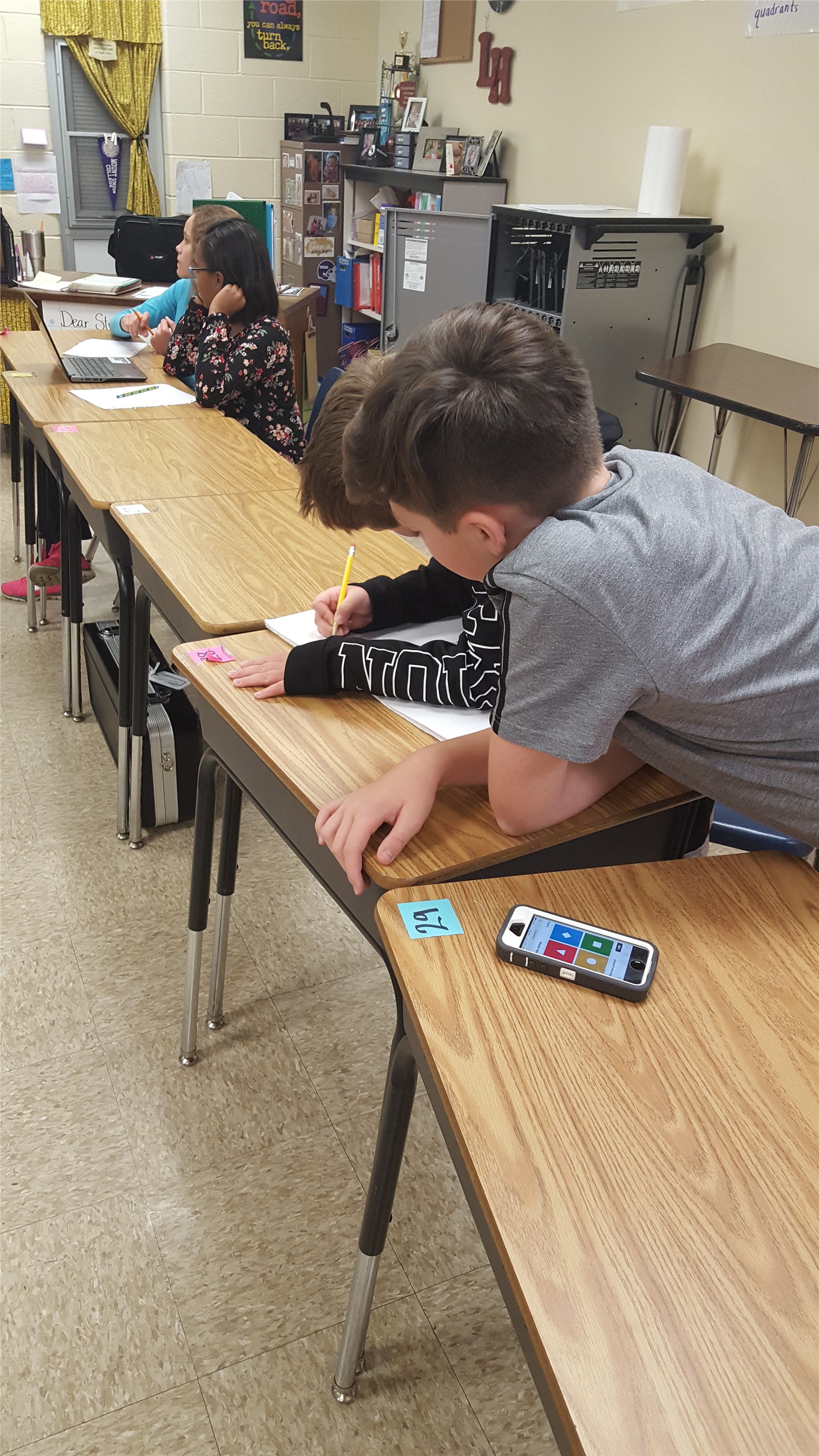 Students play "Kahoot!" to review.