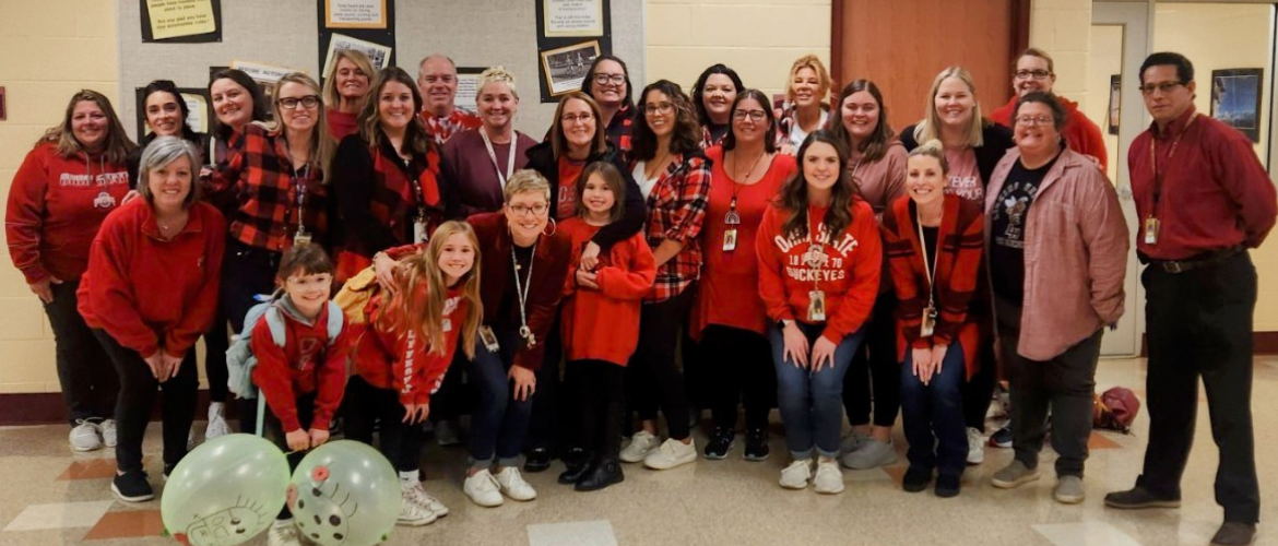 South staff wearing red and black