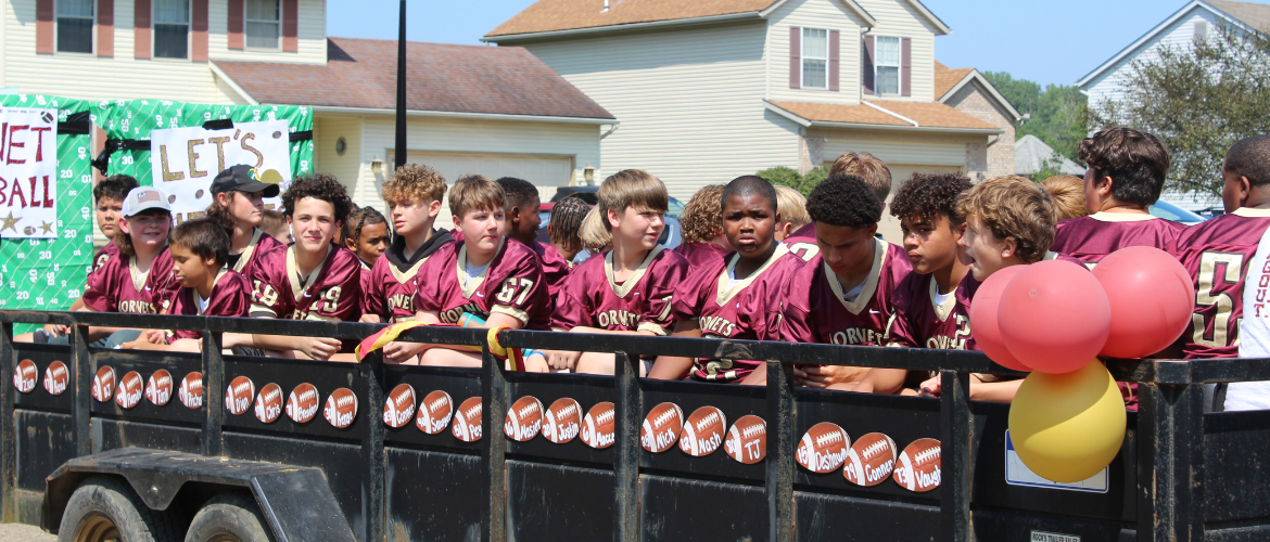 Middle school football team on parade float